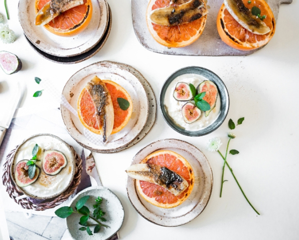 Top view of a table with plates of delicacies.